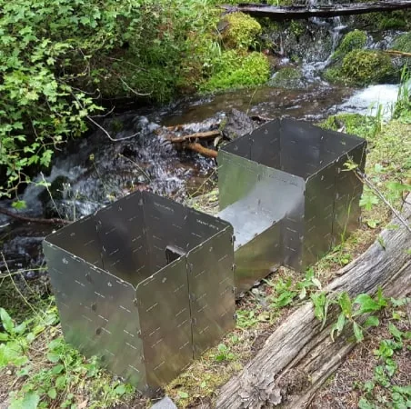 A StealthFyre Origin assembled as a tunnel stove with a pot heating on top